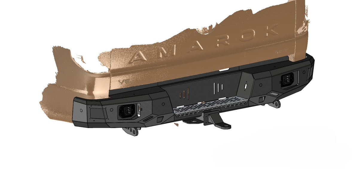 A black metal front bumper with integrated mounting points and a textured finish, shown with a tan vehicle body panel overlay on a white background. The word 'AMAROK' is embossed on the panel.